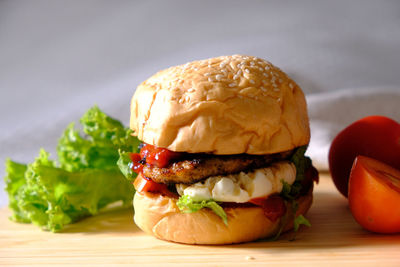 Close-up of burger on cutting board