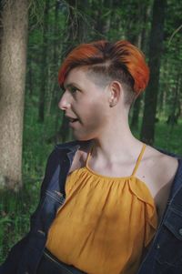 Portrait of young woman looking away