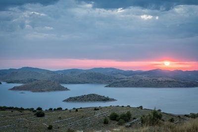 Scenic view of landscape against sky during sunset