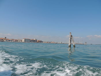 Scenic view of sea against clear blue sky