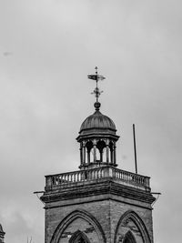 Low angle view of bell tower against sky