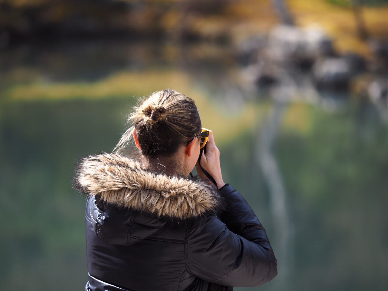 real people, focus on foreground, leisure activity, one person, lifestyles, outdoors, women, rear view, day, young women, nature, young adult, standing, blond hair, warm clothing, people