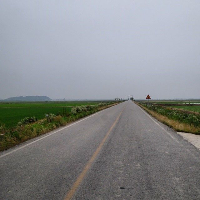 the way forward, road, transportation, diminishing perspective, country road, vanishing point, copy space, landscape, road marking, clear sky, tranquil scene, tranquility, field, empty road, empty, grass, nature, asphalt, sky, long