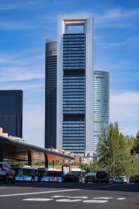 Madrid downtown business towers low angle view from urban transport interchange. city center life