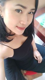 Portrait of smiling woman at home