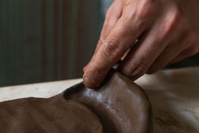 Close-up of hands on wet floor