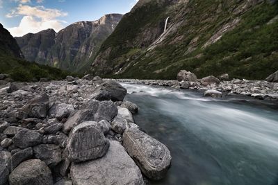 Scenic view of river flowing through rocks