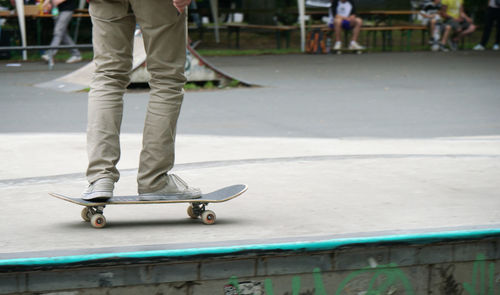 Low section of man skateboarding on skateboard