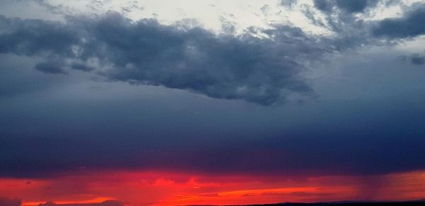 Low angle view of dramatic sky during sunset