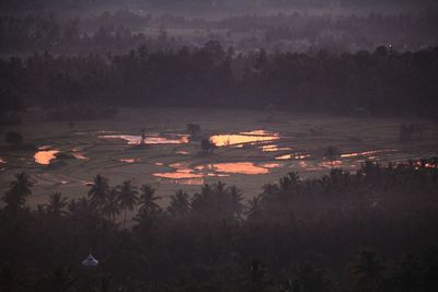 High angle view of lake against sky at sunset