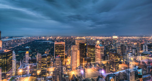 High angle view of city lit up at dusk