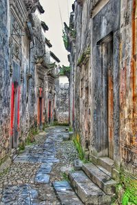 Street amidst buildings against sky