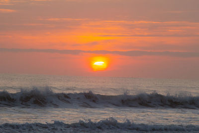 Scenic view of desert against sky during sunset