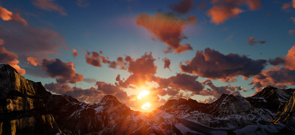 Scenic view of mountains against sky during sunset