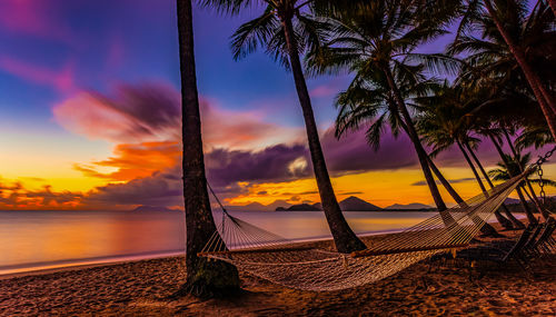 Scenic view of beach against sky during sunset