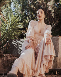 Young woman sitting outdoors