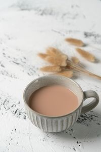 High angle view of coffee cup on table