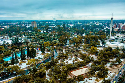 High angle view of trees and buildings against sky