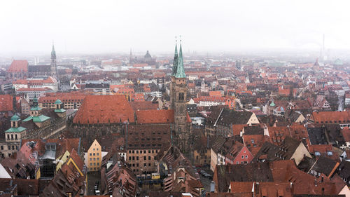 Aerial view of cityscape against sky