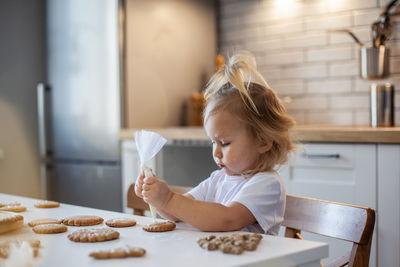 Close-up of girl making cookies