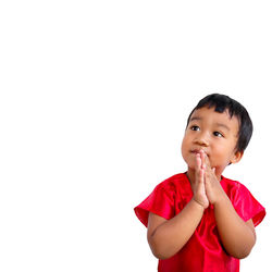 Portrait of boy against white background