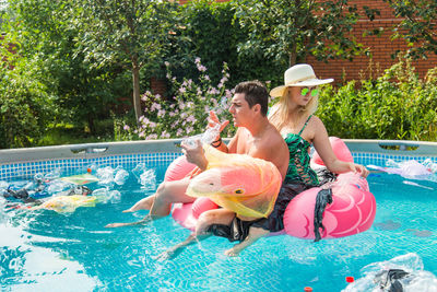 High angle view of people at swimming pool