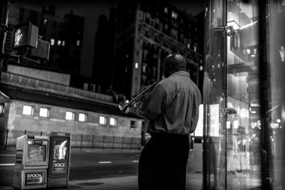 Man standing with arms outstretched