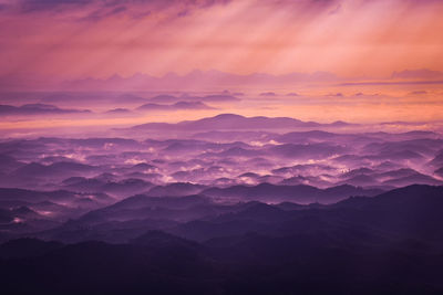 Scenic view of mountains against sky during sunset