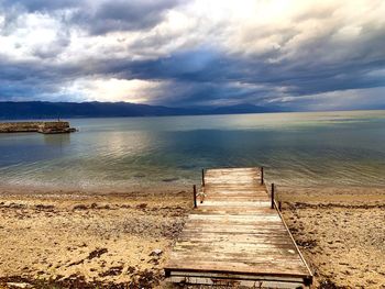 Pier over sea against sky