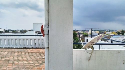 View of buildings against cloudy sky