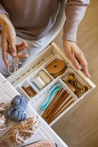 Midsection of woman working in workshop