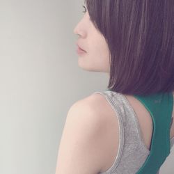 Portrait of woman against white background