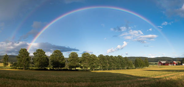 Scenic view of rainbow above landscape