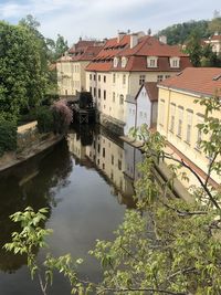 Reflection of buildings and trees in river