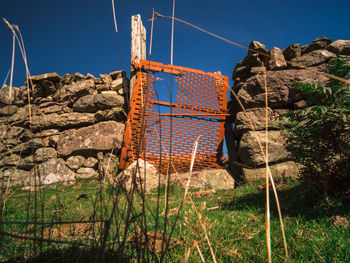 Obsolete gate with sky in background