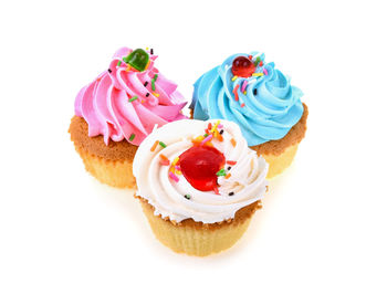 Close-up of cupcakes against white background