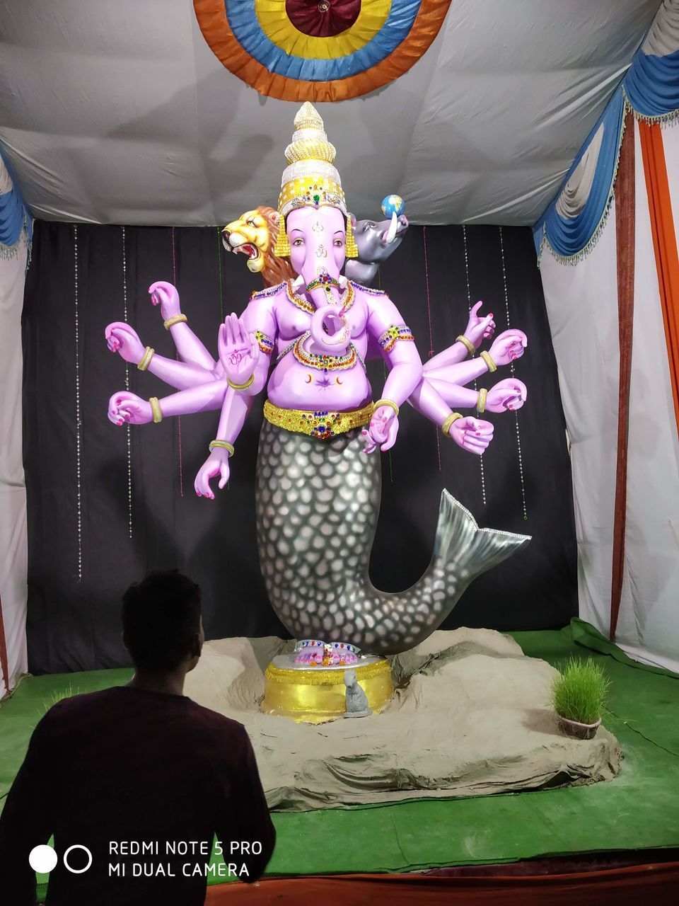 REAR VIEW OF STATUE OF BUDDHA