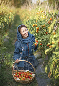 Young woman with fruits in basket