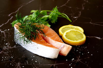 Close-up of lemon slice on table