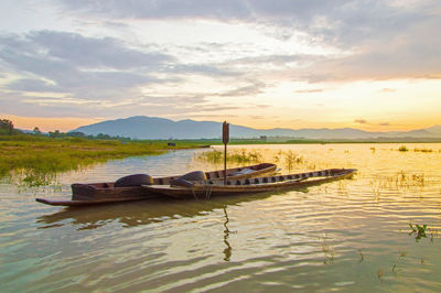 Scenic view of lake against sky during sunset
