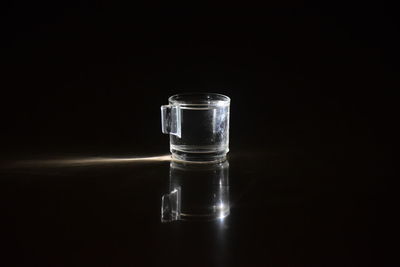 Close-up of empty glass against black background
