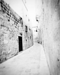 Narrow alley amidst buildings in city