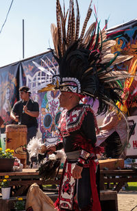 People in traditional clothing against sky