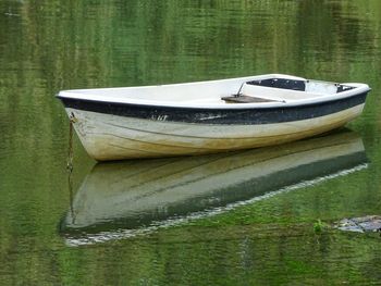 Boat moored in lake