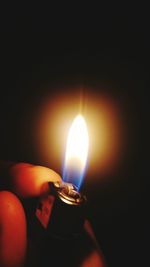 Close-up of lit candle