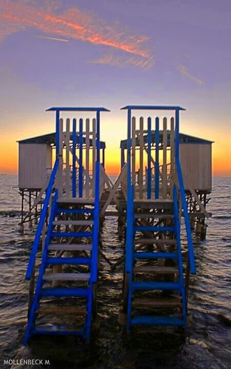 sea, wood - material, empty, water, absence, beach, sunset, sky, chair, horizon over water, tranquility, tranquil scene, seat, wooden, nature, bench, wood, outdoors, in a row, no people