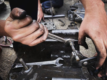 Cropped hands of man working at workshop