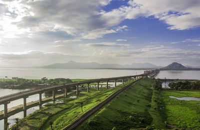 Naranarayan setu bridge by sea against cloudy sky