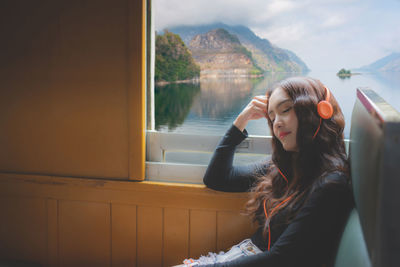 Woman looking at window