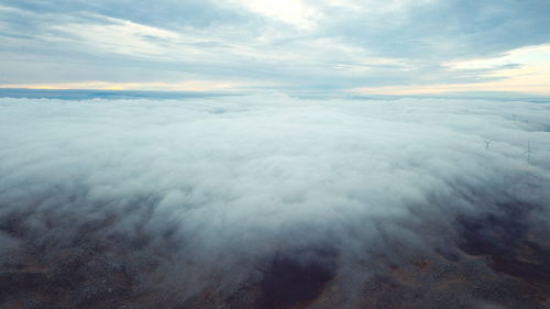 Aerial view of sea against sky during sunset